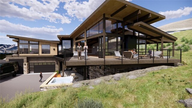 view of side of property featuring a garage and a hot tub