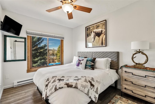 bedroom with ceiling fan, dark hardwood / wood-style flooring, and a baseboard radiator