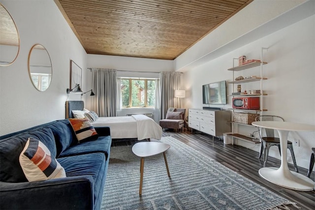 bedroom featuring dark hardwood / wood-style flooring and wood ceiling