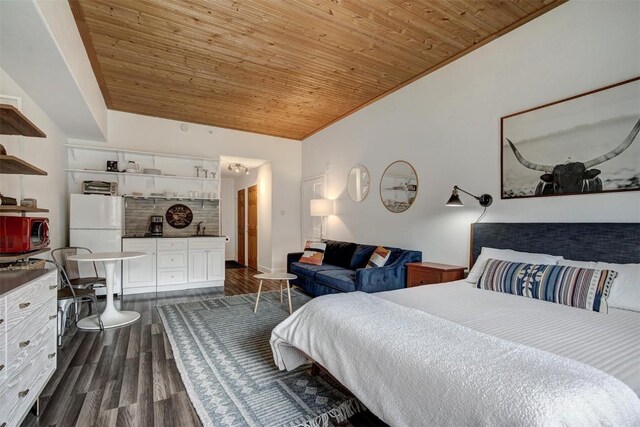 bedroom with dark wood-type flooring, wood ceiling, and white refrigerator