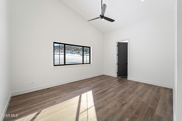 unfurnished room with ceiling fan, wood-type flooring, and high vaulted ceiling