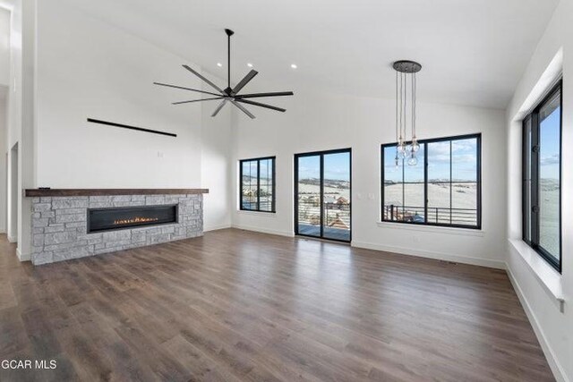 unfurnished living room with plenty of natural light and a fireplace