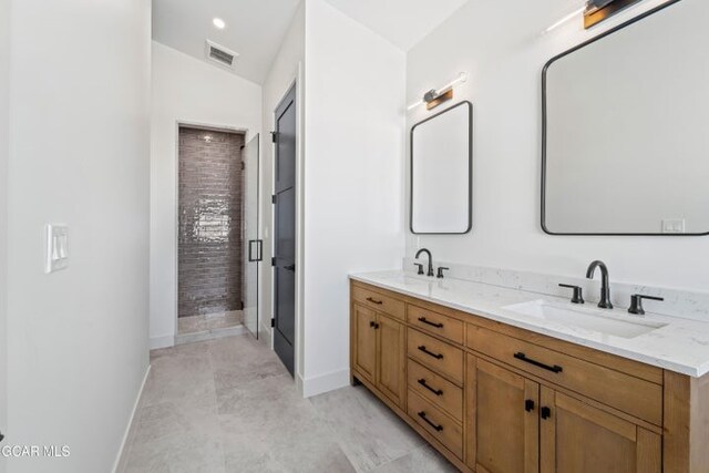 bathroom with vanity, walk in shower, and lofted ceiling