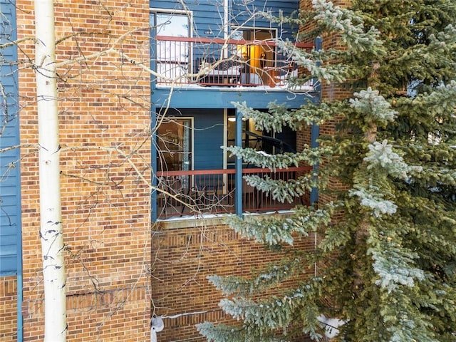 view of side of property featuring a balcony