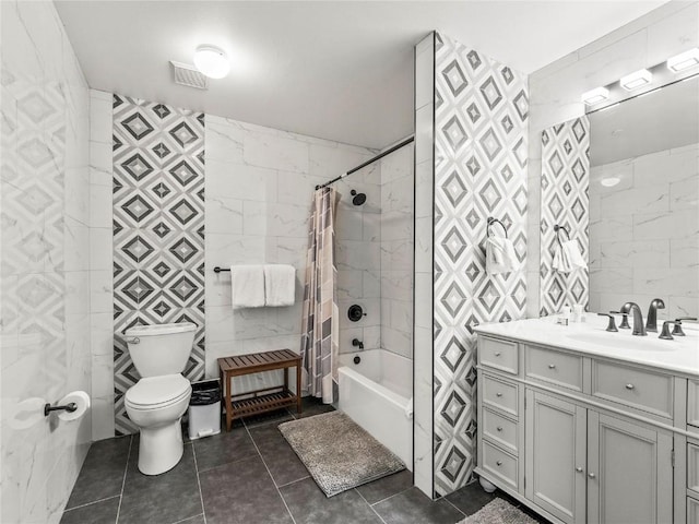 full bathroom featuring tile walls, shower / tub combo, tile patterned floors, and toilet