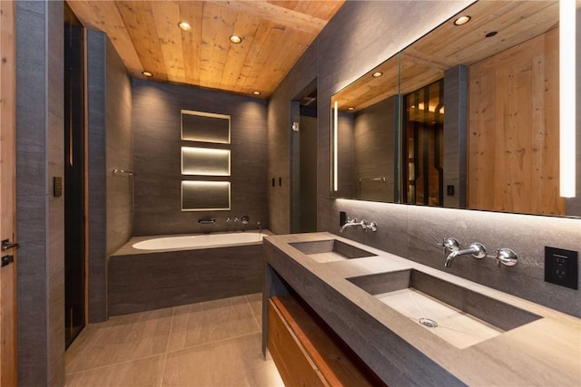 bathroom featuring tile patterned flooring, vanity, a relaxing tiled tub, and wooden ceiling