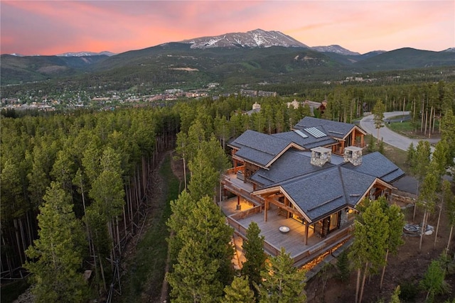 aerial view at dusk featuring a mountain view