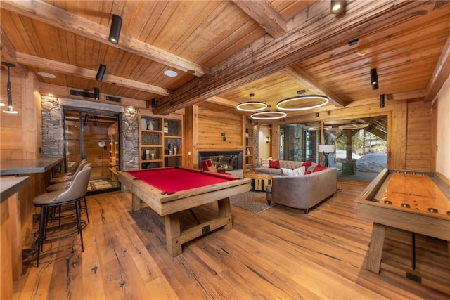 rec room with hardwood / wood-style floors, wood walls, wooden ceiling, billiards, and beamed ceiling