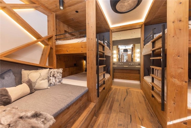 bedroom with wood-type flooring and wood ceiling