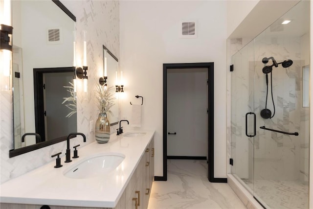 bathroom with vanity and an enclosed shower