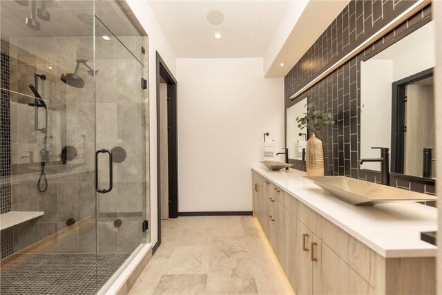 bathroom featuring vanity and an enclosed shower