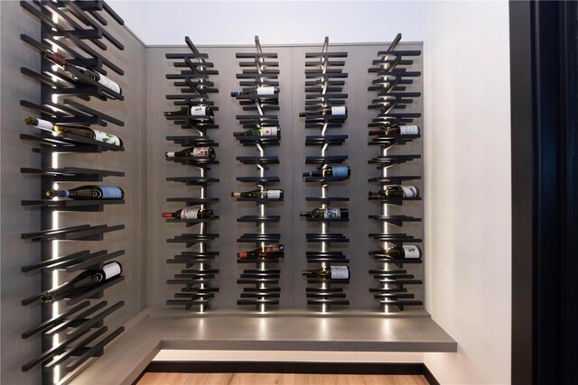 wine cellar with hardwood / wood-style floors and electric panel