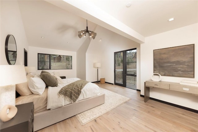 bedroom with access to outside, light hardwood / wood-style flooring, and lofted ceiling