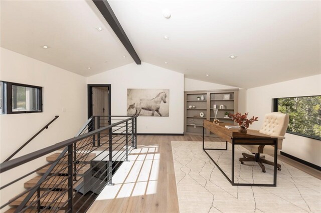 office with vaulted ceiling with beams and light hardwood / wood-style floors