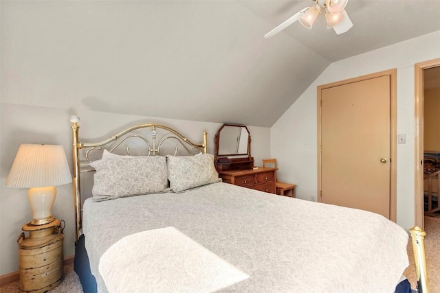 carpeted bedroom featuring ceiling fan and lofted ceiling