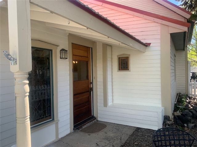 doorway to property with a porch