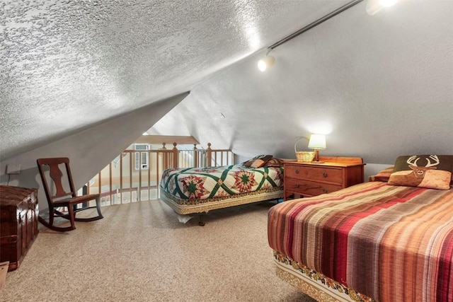 bedroom with a textured ceiling and lofted ceiling