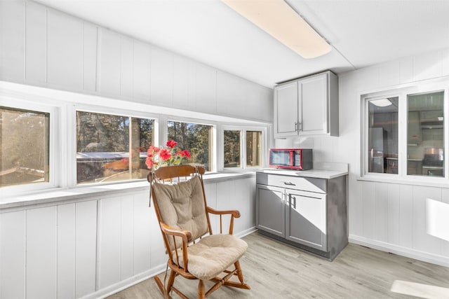 interior space featuring light wood-style floors and stainless steel refrigerator