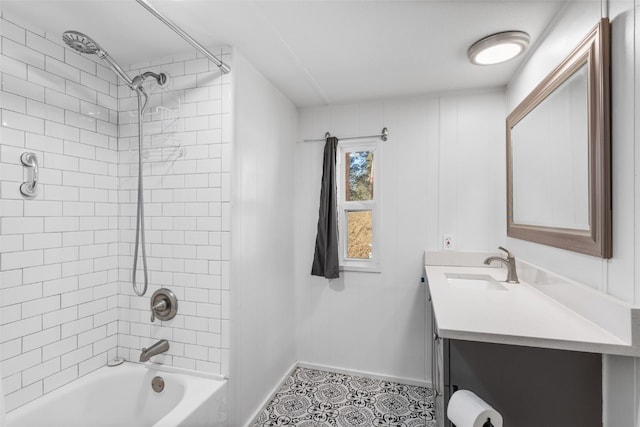 bathroom with tile patterned flooring, baseboards, shower / bathing tub combination, and vanity