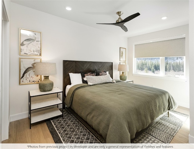 bedroom featuring hardwood / wood-style floors and ceiling fan