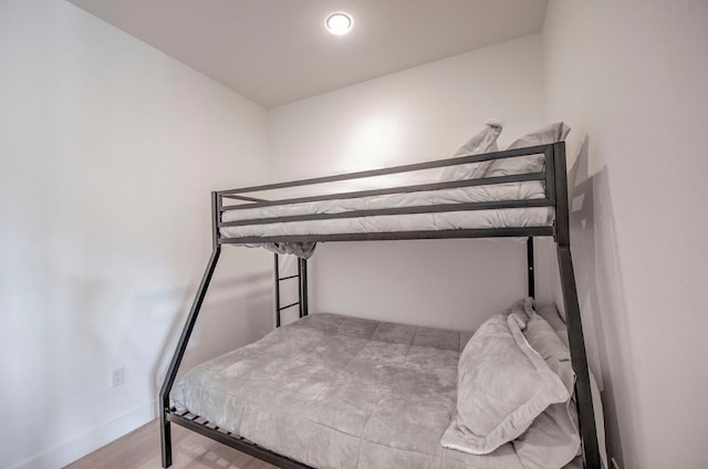 bedroom with wood-type flooring