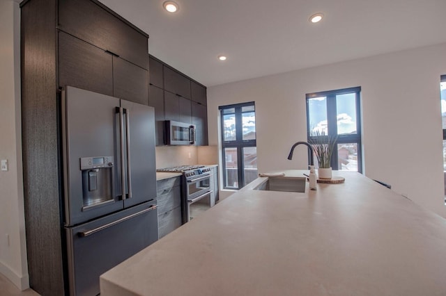 kitchen featuring high quality appliances and sink