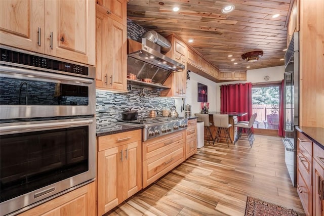 kitchen featuring appliances with stainless steel finishes, backsplash, light hardwood / wood-style floors, light brown cabinets, and wooden ceiling