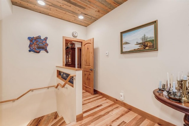 corridor featuring wooden ceiling and light wood-type flooring