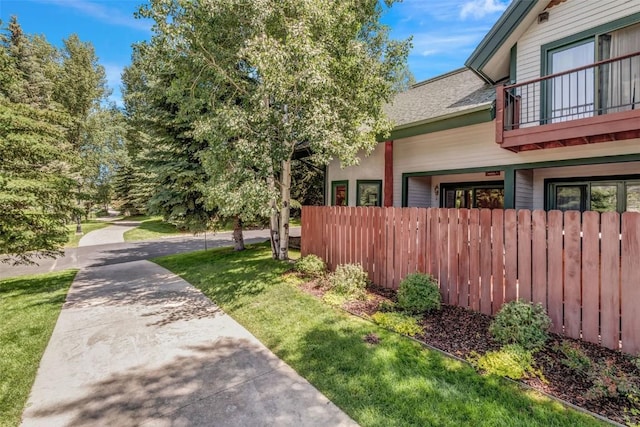 view of side of home featuring a yard