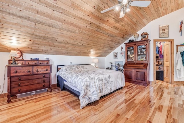 bedroom featuring ceiling fan, lofted ceiling, light hardwood / wood-style flooring, and wooden ceiling