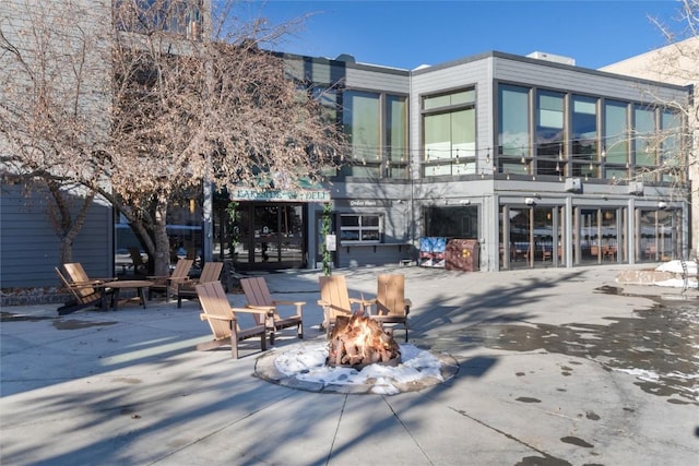 view of patio / terrace featuring an outdoor fire pit