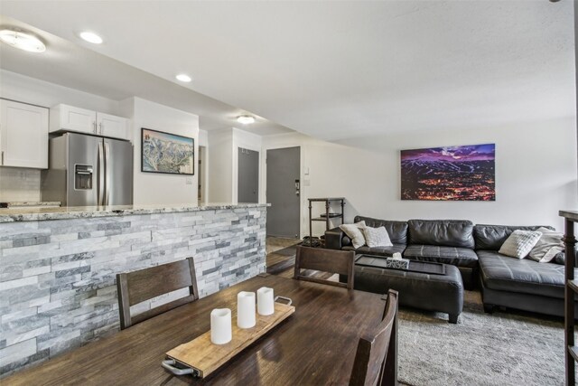 dining area featuring dark hardwood / wood-style flooring