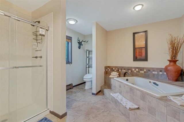 bathroom with toilet, a baseboard radiator, and separate shower and tub