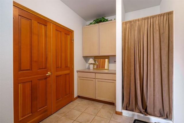 kitchen with light tile patterned flooring