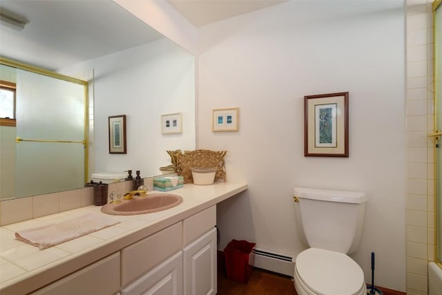 full bathroom featuring vanity, a baseboard radiator, combined bath / shower with glass door, and toilet