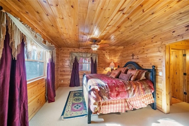 carpeted bedroom with wood ceiling and wood walls