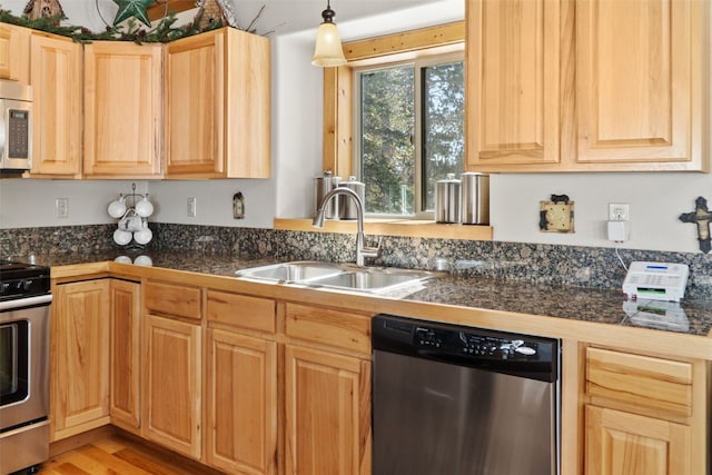 kitchen featuring tile countertops, light brown cabinets, appliances with stainless steel finishes, and a sink