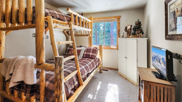 bedroom with light carpet