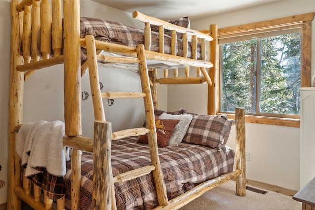 bedroom with carpet floors and visible vents