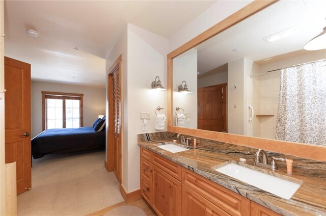 bathroom featuring a shower with curtain and vanity