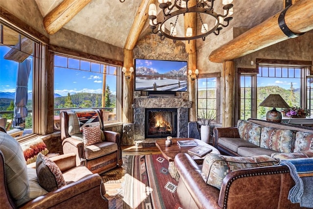 living room with an inviting chandelier, a fireplace, and lofted ceiling with beams