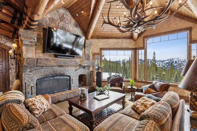 living room featuring a fireplace, wooden ceiling, wood finished floors, a notable chandelier, and high vaulted ceiling