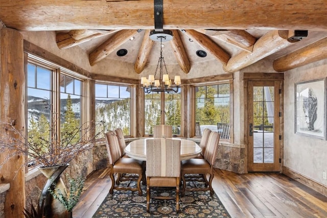 unfurnished sunroom featuring vaulted ceiling with beams and an inviting chandelier