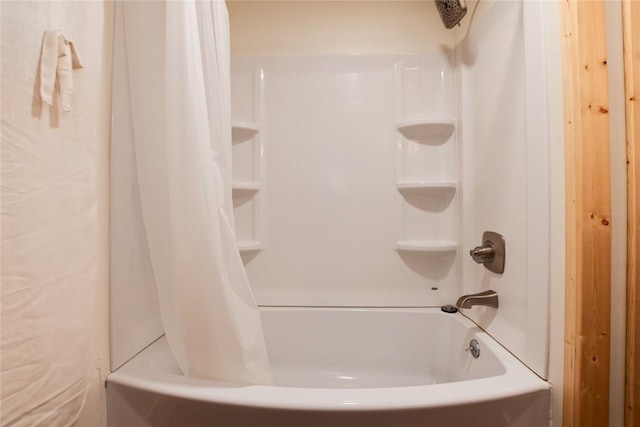 bathroom with shower / bathtub combination with curtain