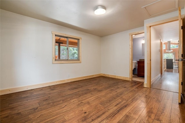 spare room featuring hardwood / wood-style floors