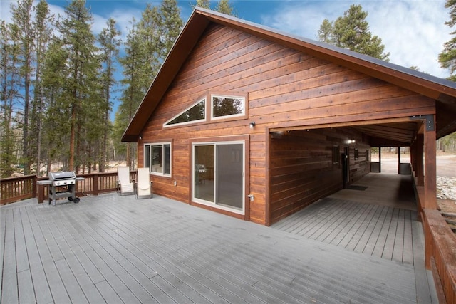 wooden deck featuring area for grilling