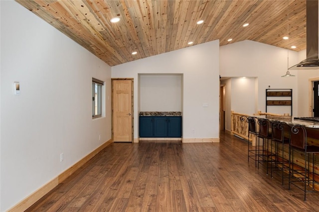 spare room featuring dark hardwood / wood-style floors, wooden ceiling, and high vaulted ceiling