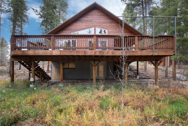 back of house featuring a deck