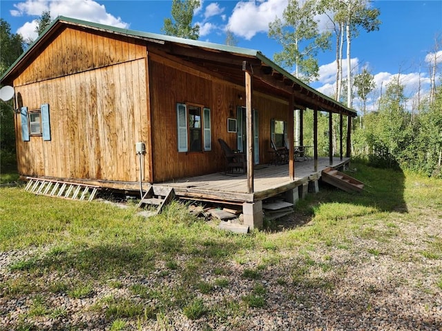 view of side of home featuring a lawn