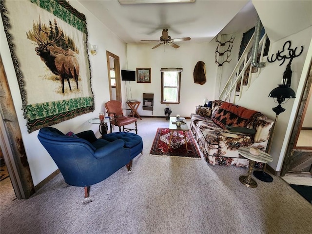 carpeted living room featuring ceiling fan